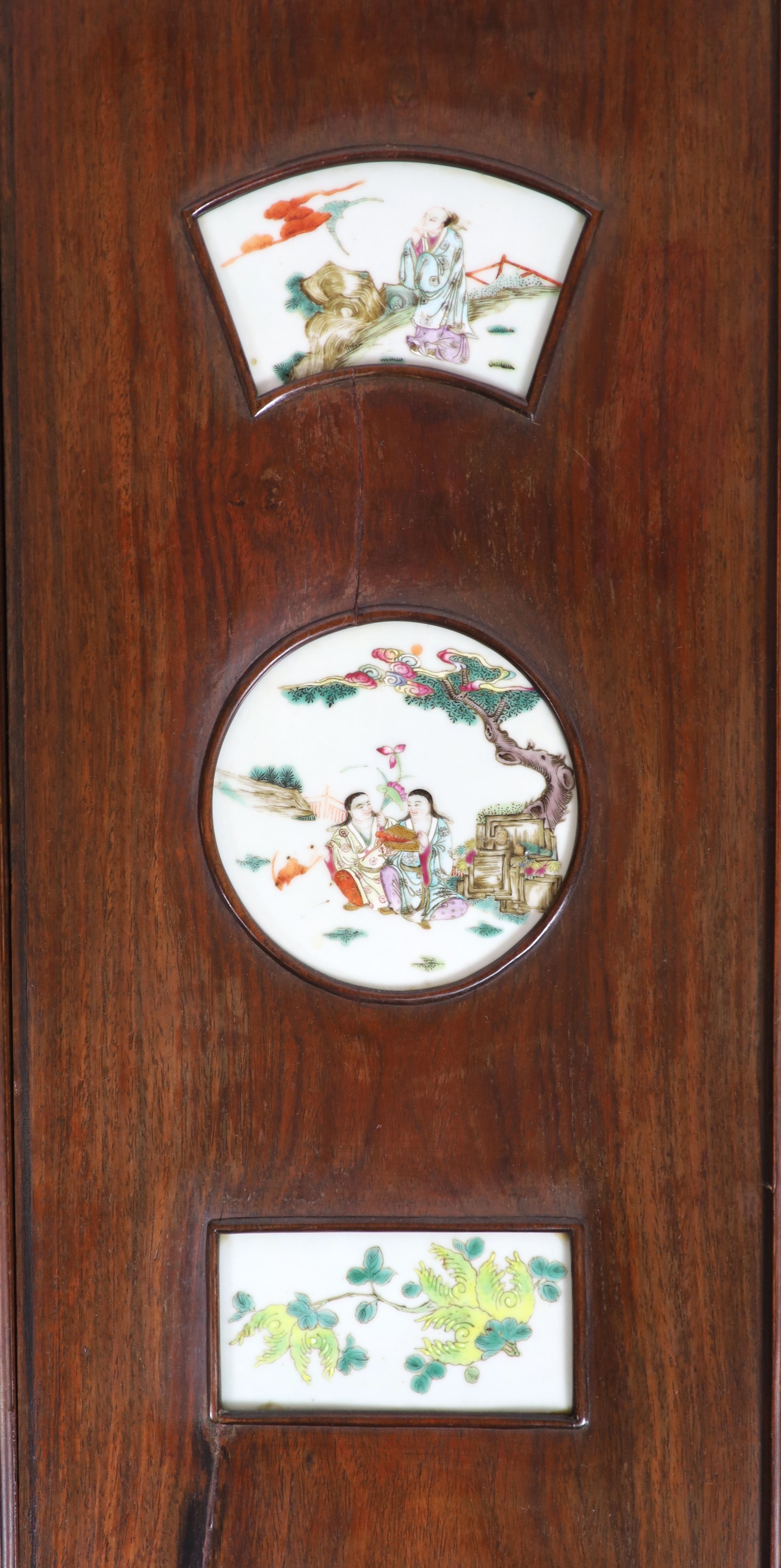 A Chinese porcelain mounted hardwood four fold screen, mid 19th century, Total size 127cm high x 122cm wide